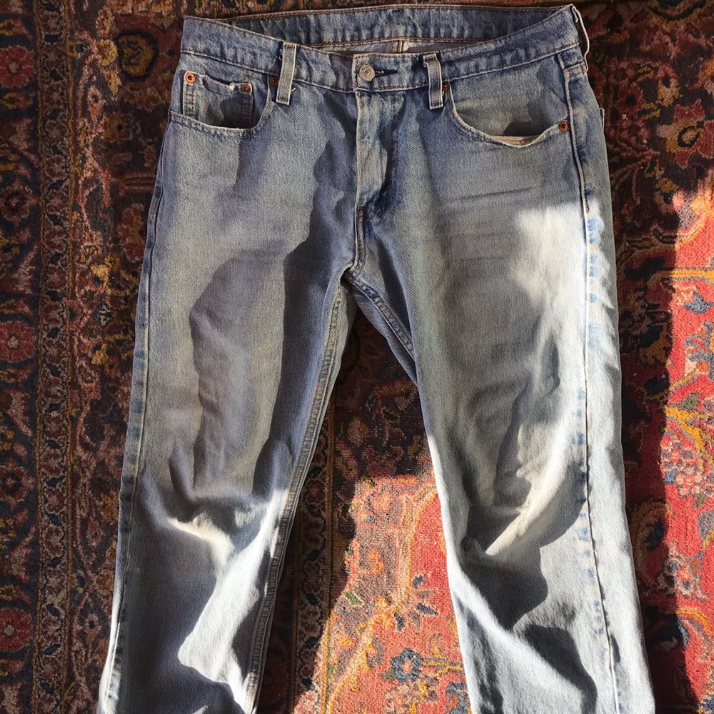 Levis 502 30x30. Ripped under butt.